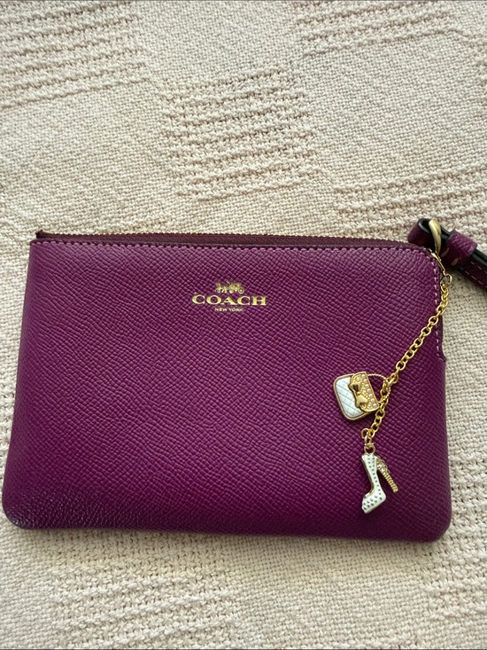 Coach Handbags - Coach Fuchsia Leather Wristlet Pouch with Gold Hardware with charm